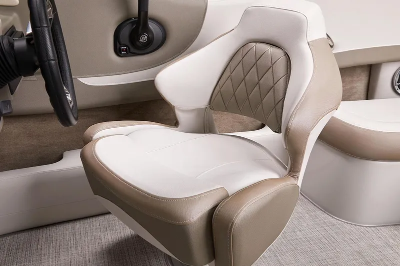 Slide: The Image of Manufacturer Provided Image: 2026 Crownline 220 SS boat interior with beige and white cushioned seating. - 6