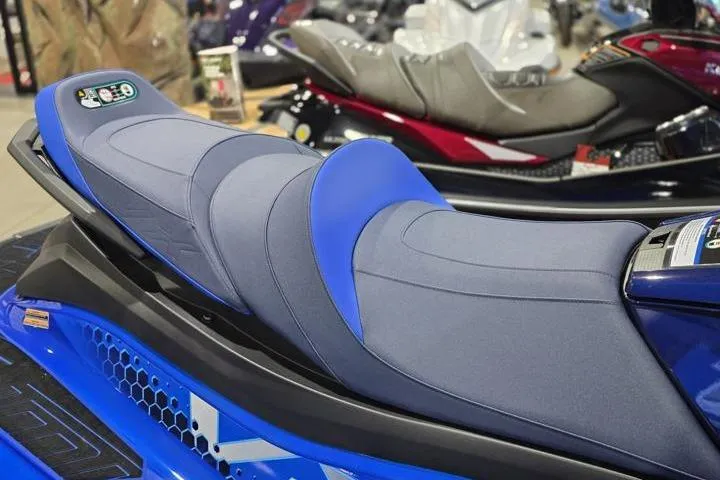 Slide: The Image of 2026 Yamaha WaveRunner VX Limited HO, blue seat detail, in showroom setting. - 10