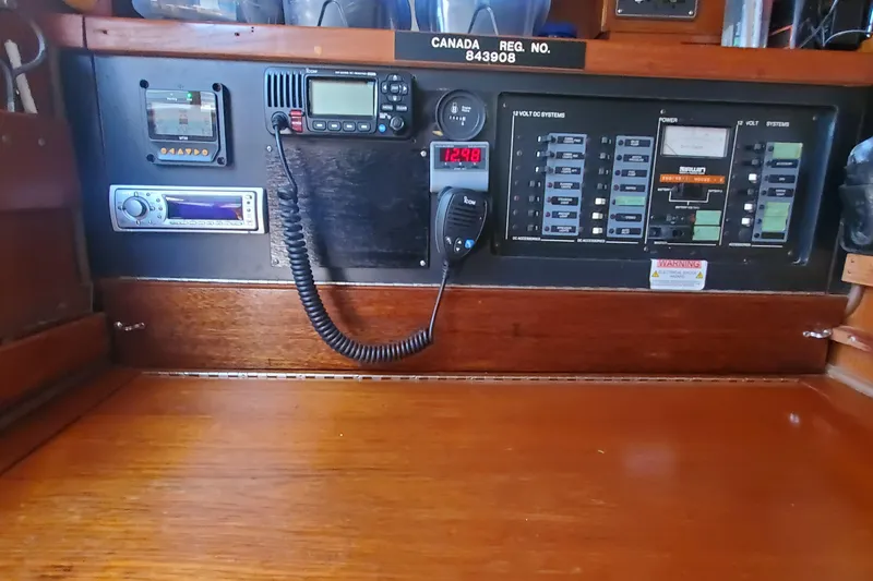 Slide: The Image of Control panel of a 1987 Irwin 38 Mk II sailboat with navigation and communication equipment. - 7