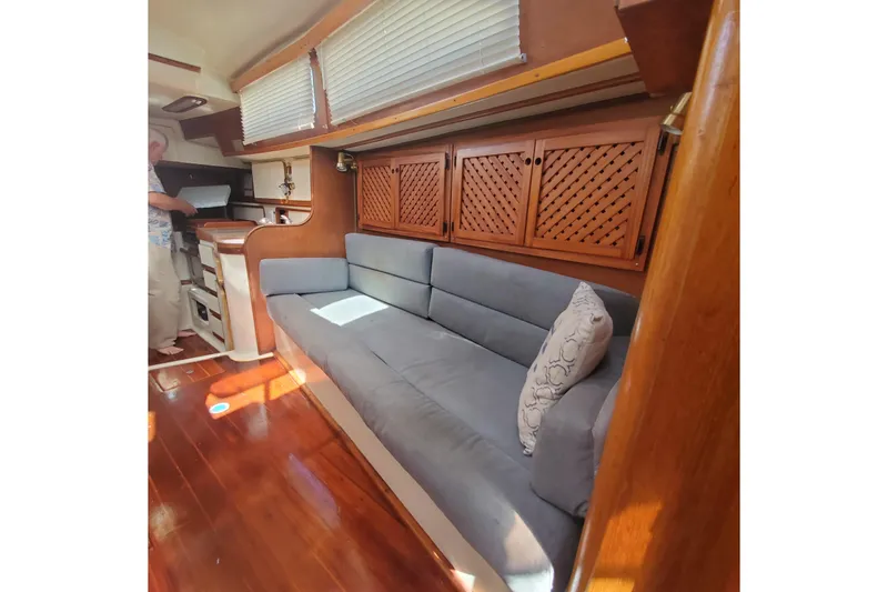 Slide: The Image of Interior of 1987 Irwin 38 Mk II yacht with cozy seating and wooden cabinetry. - 9