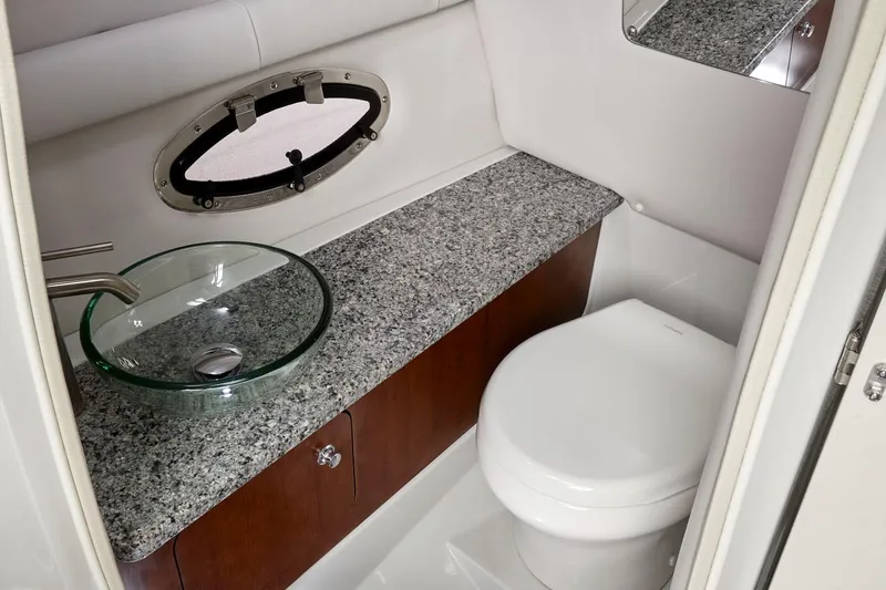 Slide: The Image of 2022 Crownline 265 SS boat interior with spacious seating and modern design. - 10