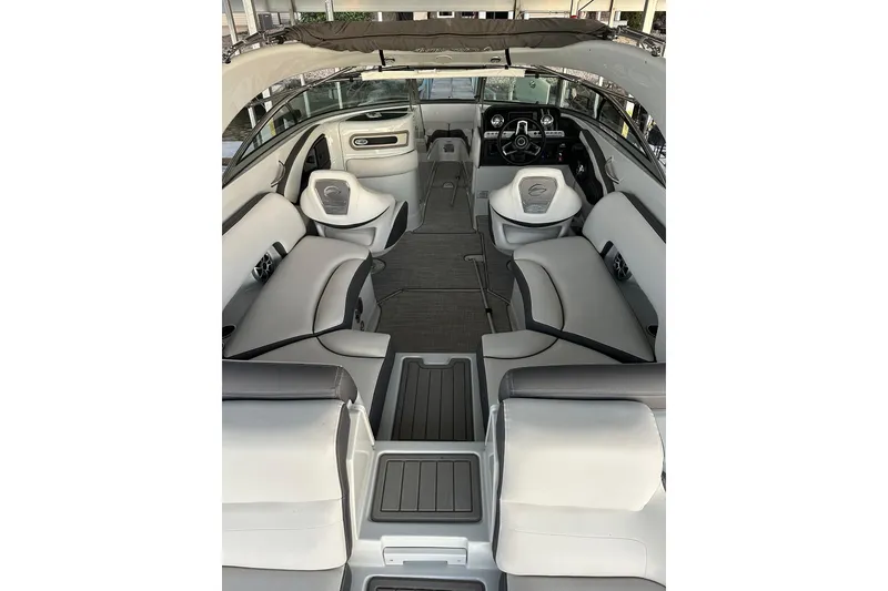 Slide: The Image of 2022 Crownline 265 SS boat interior with modern dashboard and seating. - 11