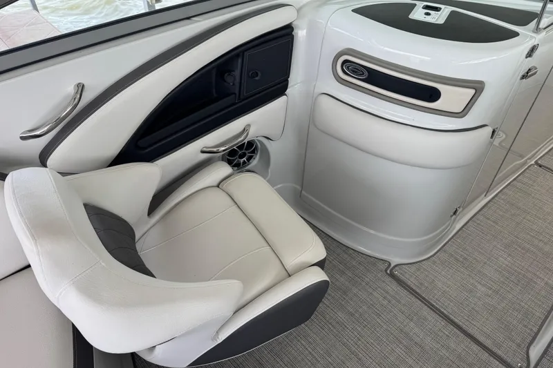 Slide: The Image of Interior of 2022 Crownline 265 SS boat, featuring sleek seating and modern design elements. - 15