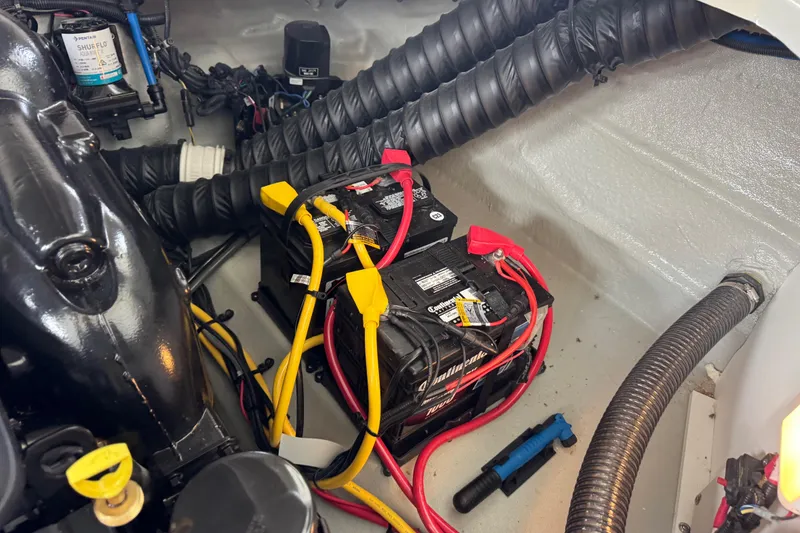 Slide: The Image of 2022 Crownline 265 SS boat engine compartment with batteries and wiring. - 18
