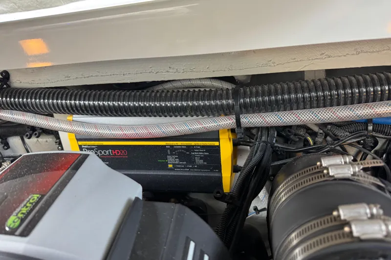 Slide: The Image of Engine compartment of 2022 Crownline 265 SS with ProSport HD20 charger visible. - 20