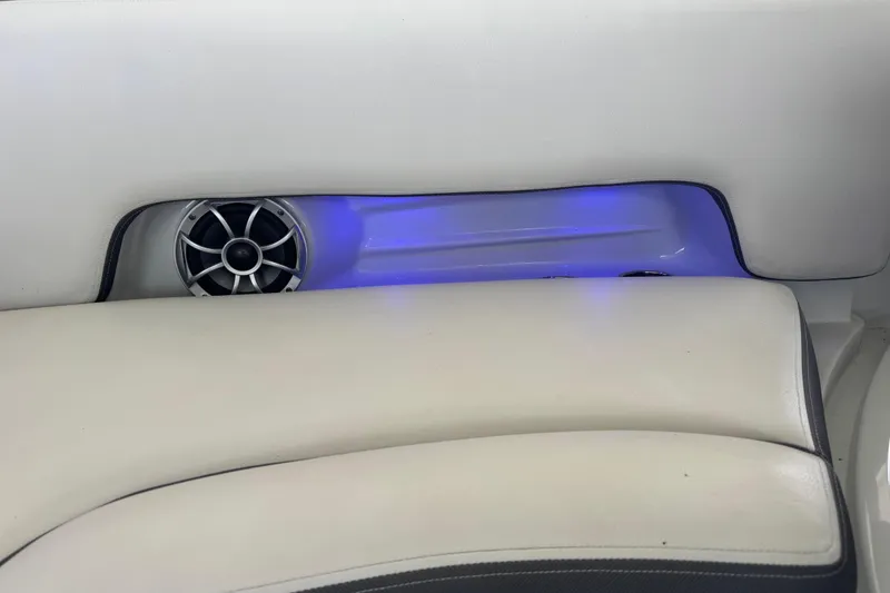 Slide: The Image of 2022 Crownline 265 SS boat interior with speaker and blue LED lighting. - 22