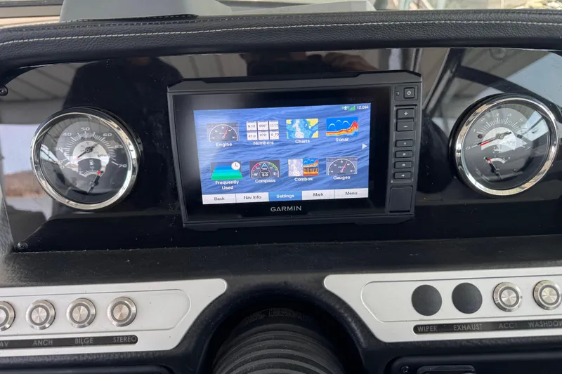 Slide: The Image of Dashboard of 2022 Crownline 265 SS with Garmin display and gauges. - 25