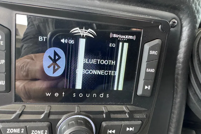 Slide: The Image of Crownline 265 SS 2022 boat stereo display showing Bluetooth connection status. - 26