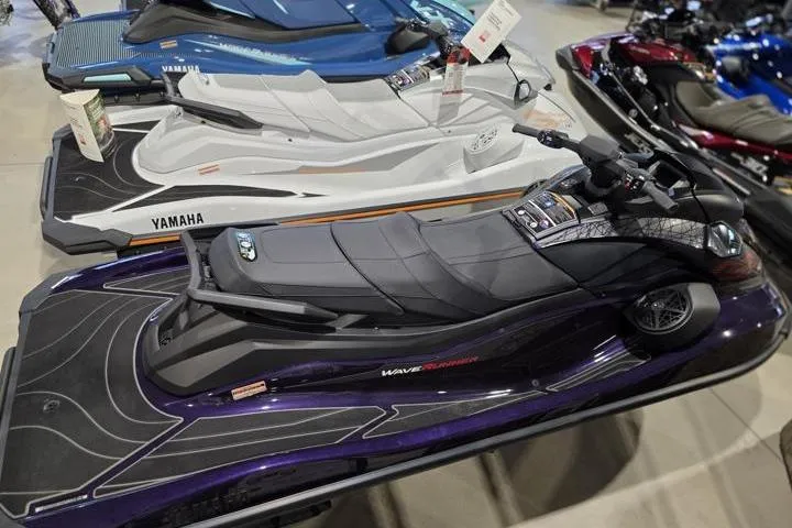 Slide: The Image of 2026 Yamaha WaveRunner GP HO jet ski in showroom, sleek design, black and purple color scheme. - 9