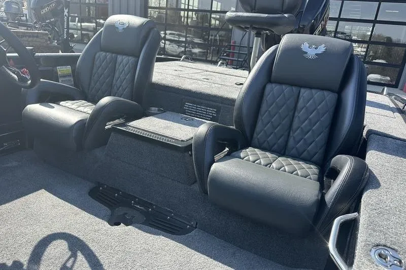 Slide: The Image of 2026 Phoenix 919 ZXL boat interior with luxurious black leather seats and diamond stitching. - 4