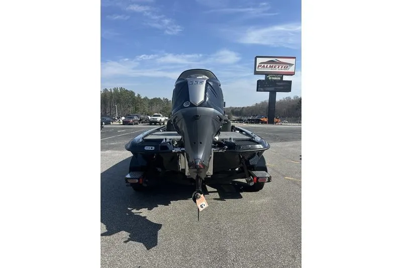 Slide: The Image of 2026 Phoenix 919 ZXL boat on trailer in parking lot, clear sky background. - 8