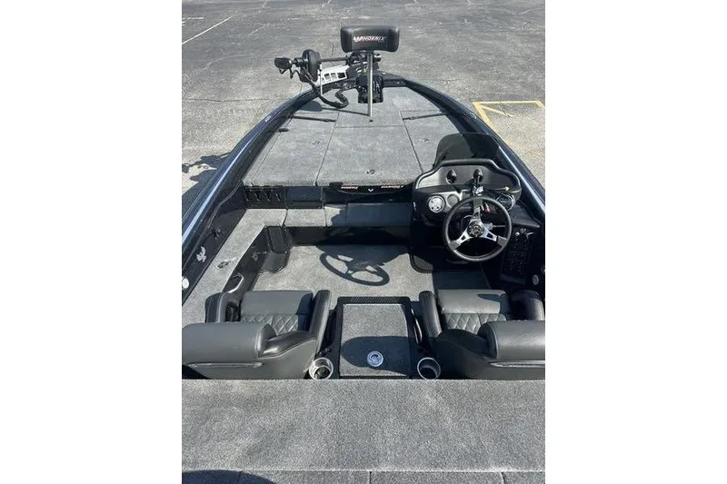 Slide: The Image of 2026 Phoenix 919 ZXL boat interior with steering wheel and seating. - 9