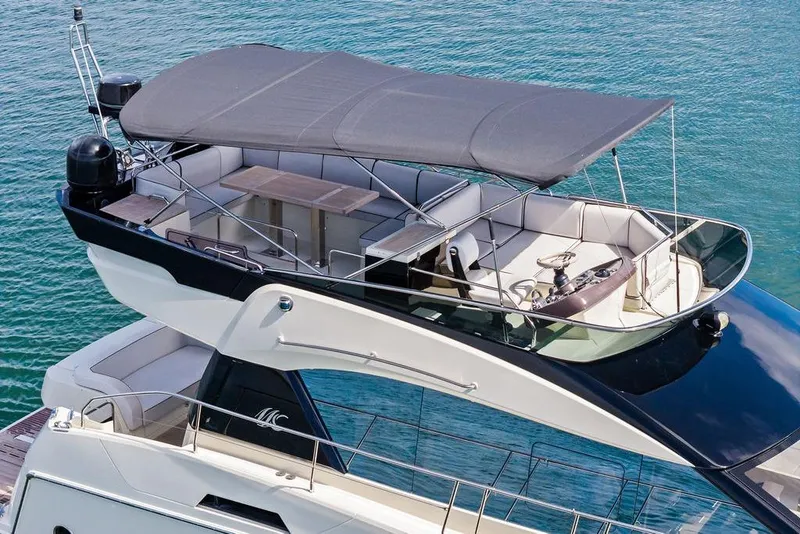 Slide: The Image of Luxury Monte Carlo MC 35 yacht, 2018 model, with spacious upper deck and canopy. - 10