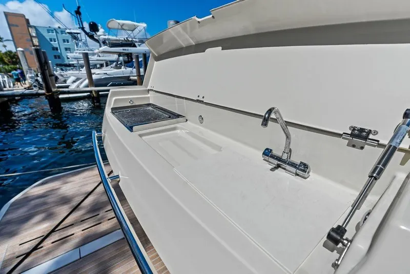 Slide: The Image of Outdoor sink on 2018 Monte Carlo MC 35 yacht, docked at marina. - 13