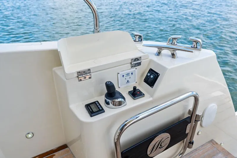 Slide: The Image of Control panel of 2018 Monte Carlo MC 35 yacht with water in the background. - 14