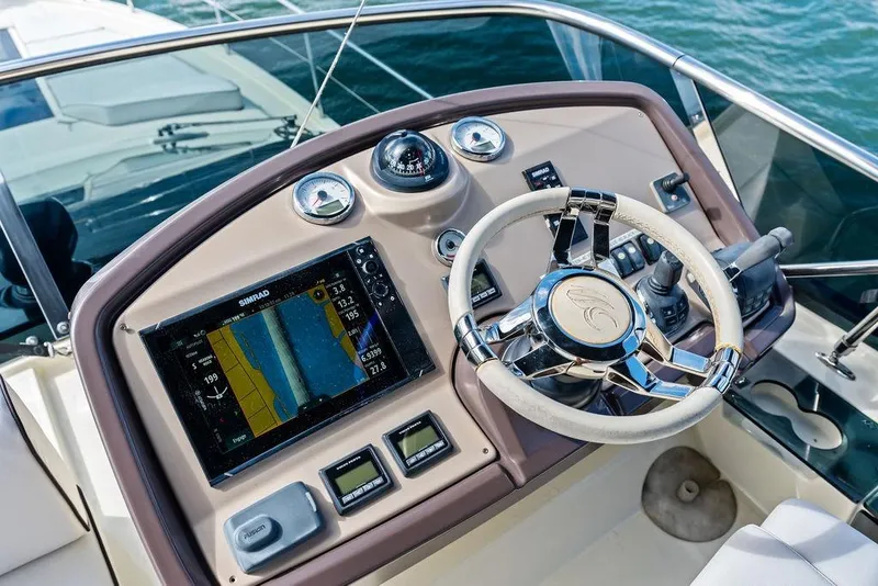 Slide: The Image of Cockpit of 2018 Monte Carlo MC 35 yacht with navigation system and steering wheel. - 19