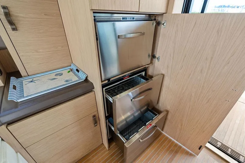 Slide: The Image of Modern kitchen area in 2018 Monte Carlo MC 35 yacht with stainless steel appliances. - 28