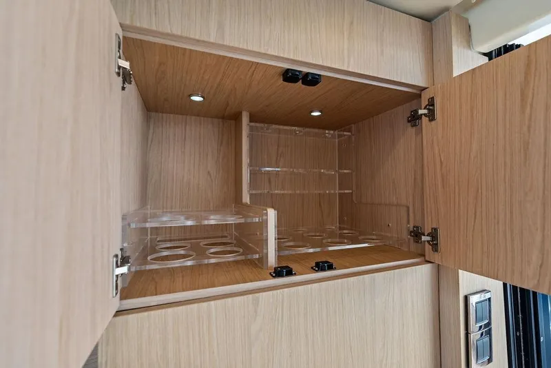 Slide: The Image of Wooden cabinet with open doors and acrylic storage, Monte Carlo MC 35, 2018 model. - 29