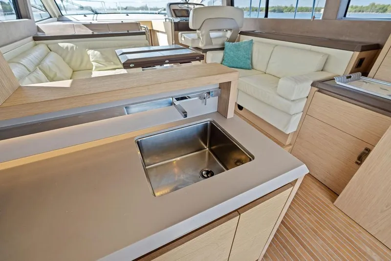 Slide: The Image of Luxurious interior of 2018 Monte Carlo MC 35 yacht with modern kitchen and seating area. - 31