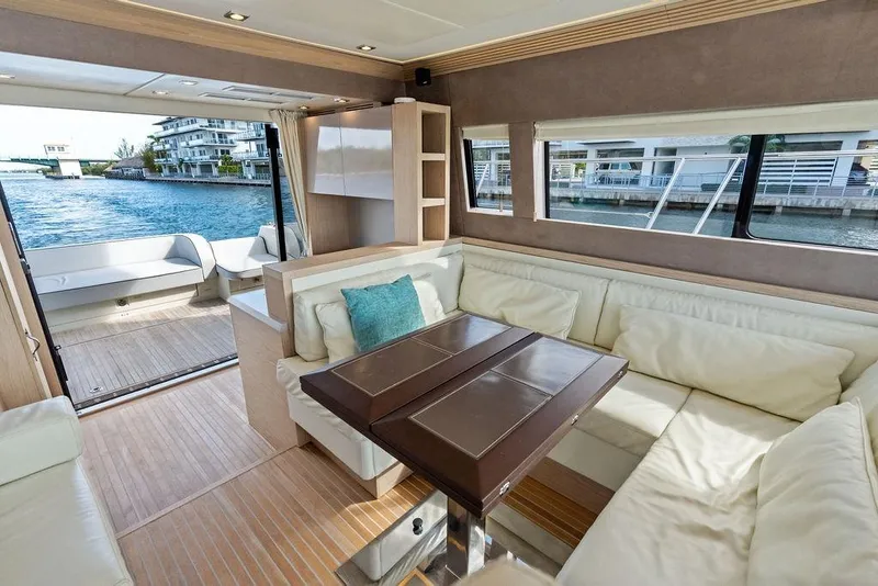 Slide: The Image of Luxurious interior of 2018 Monte Carlo MC 35 yacht with elegant seating and water view. - 33