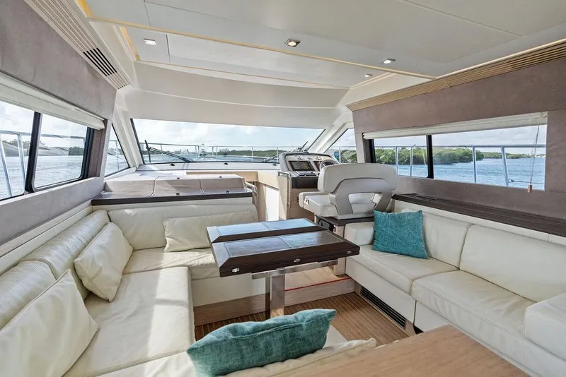 Slide: The Image of Luxurious interior of 2018 Monte Carlo MC 35 yacht with plush seating and scenic windows. - 34