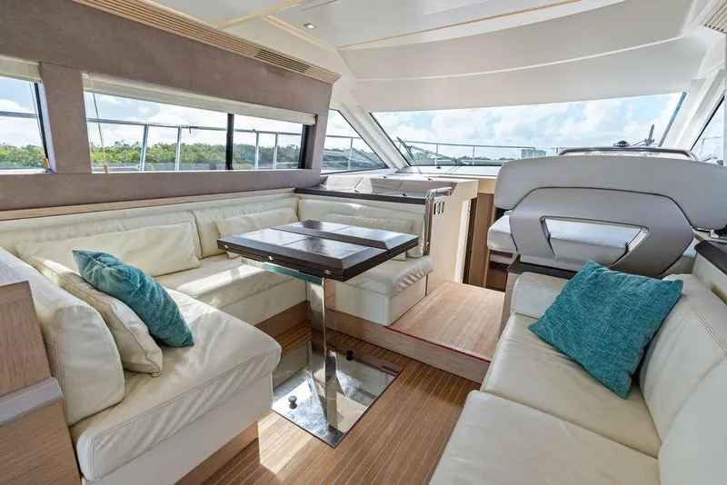 Slide: The Image of Luxurious interior of 2018 Monte Carlo MC 35 yacht with plush seating and elegant decor. - 35