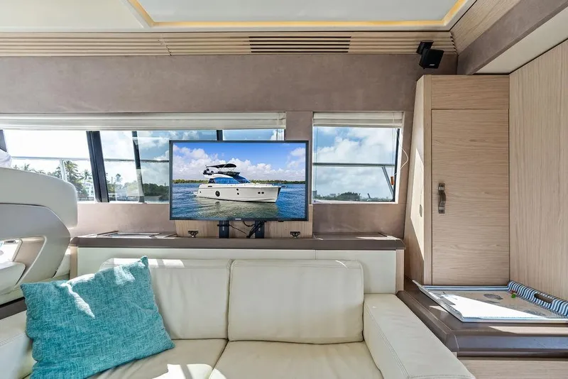 Slide: The Image of Luxurious interior of 2018 Monte Carlo MC 35 yacht with TV and comfortable seating. - 36