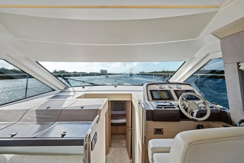 Slide: The Image of Luxurious interior of 2018 Monte Carlo MC 35 yacht, featuring modern helm and panoramic views. - 39
