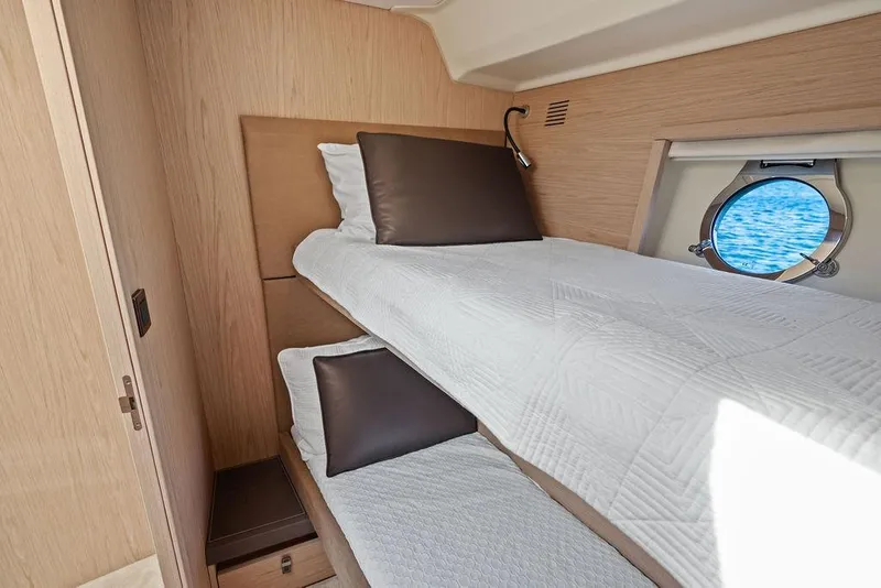 Slide: The Image of Interior cabin of 2018 Monte Carlo MC 35 yacht with bunk beds and porthole view. - 47