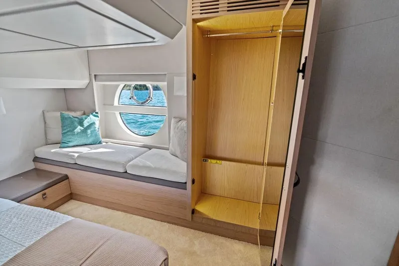 Slide: The Image of Luxurious interior of 2018 Monte Carlo MC 35 yacht with window view and seating area. - 50