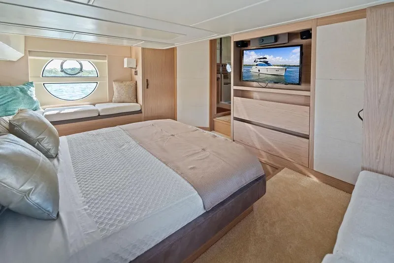 Slide: The Image of Luxurious bedroom interior of 2018 Monte Carlo MC 35 yacht with modern decor and window view. - 51