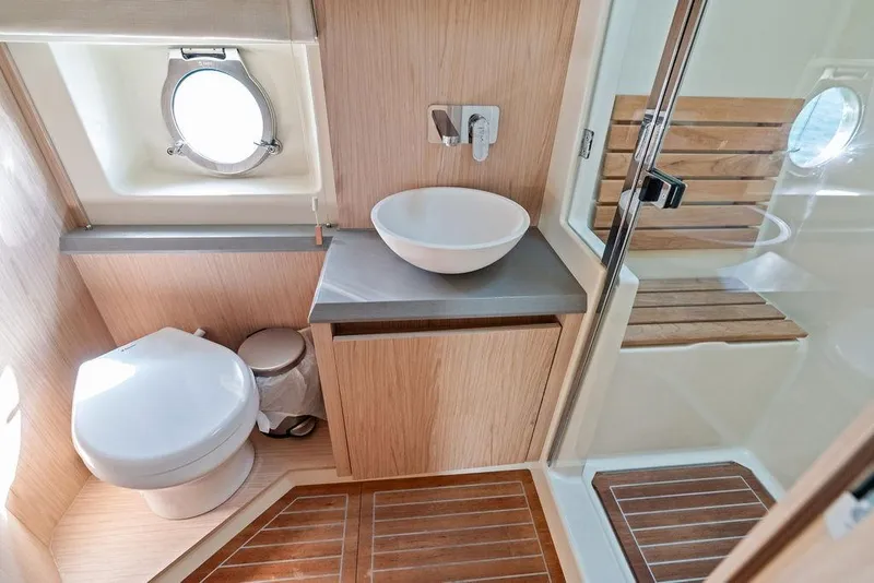 Slide: The Image of Luxurious 2018 Monte Carlo MC 35 yacht bathroom with modern fixtures and wooden accents. - 53