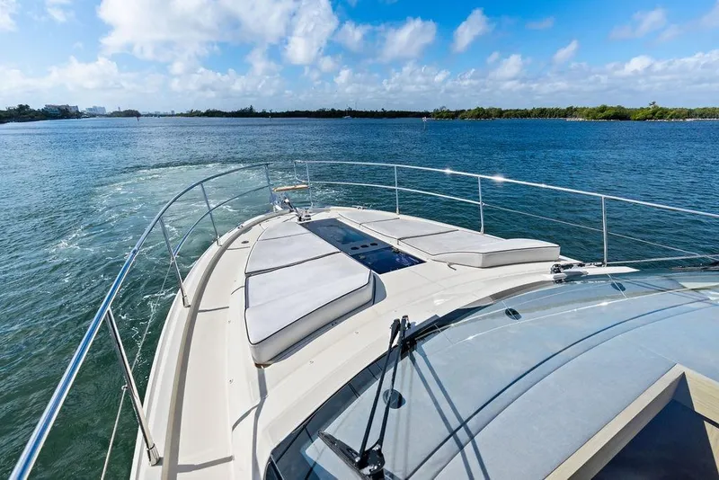 Slide: The Image of 2018 Monte Carlo MC 35 yacht cruising on a sunny day with clear blue skies. - 55