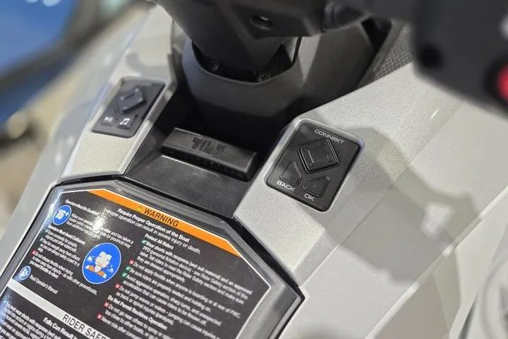 Slide: The Image of 2026 Yamaha WaveRunner GP HO dashboard controls with warning label and buttons. - 11