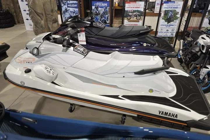 Slide: The Image of 2026 Yamaha WaveRunner GP HO jet ski displayed in showroom, white and black design. - 3