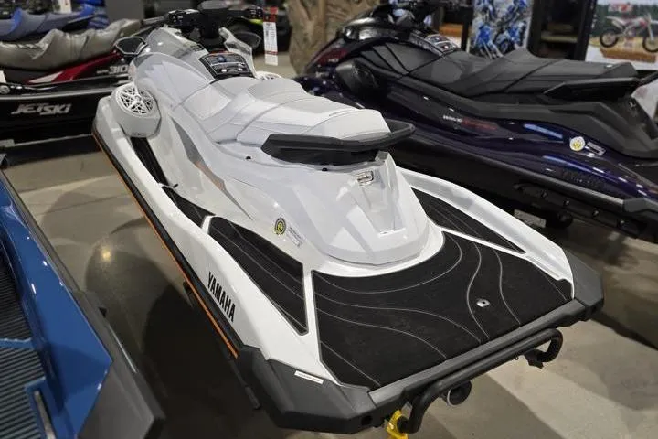 Slide: The Image of 2026 Yamaha WaveRunner GP HO jet ski in showroom, sleek white design. - 4