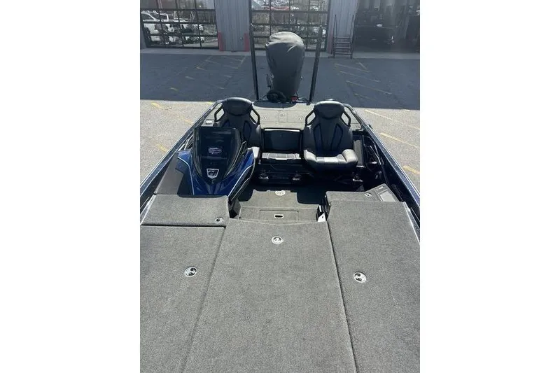 Slide: The Image of 2020 Skeeter FXR21 boat interior with seating and storage compartments. - 9