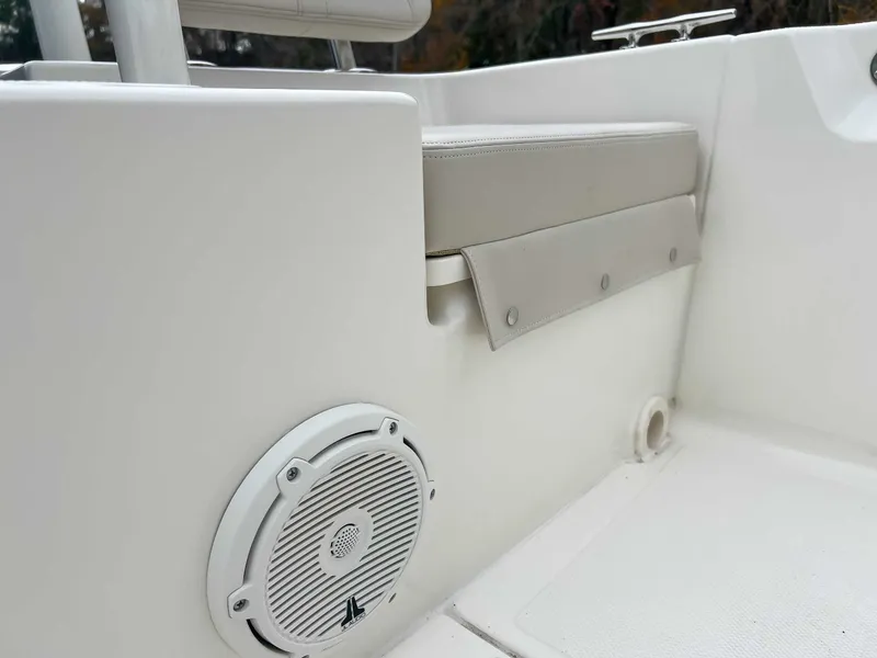 Slide: The Image of Boston Whaler 190 Montauk 2025, seating area with speaker. - 25