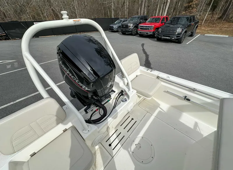 Slide: The Image of 2025 Boston Whaler 170 Montauk with Mercury engine, parked in a lot. - 18