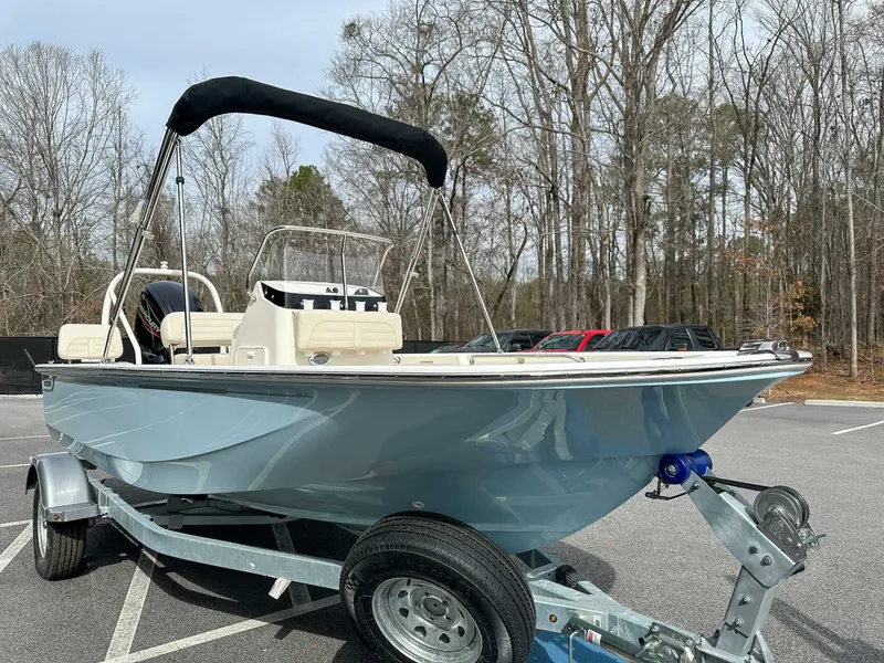 Slide: The Image of 2025 Boston Whaler 170 Montauk on trailer parked outdoors. - 5