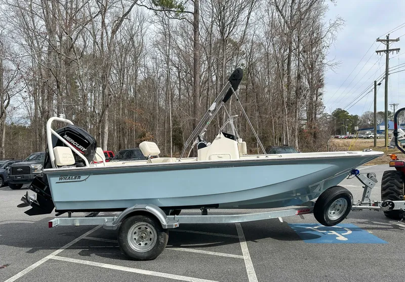 Slide: The Image of 2025 Boston Whaler 170 Montauk on trailer parked outdoors. - 6