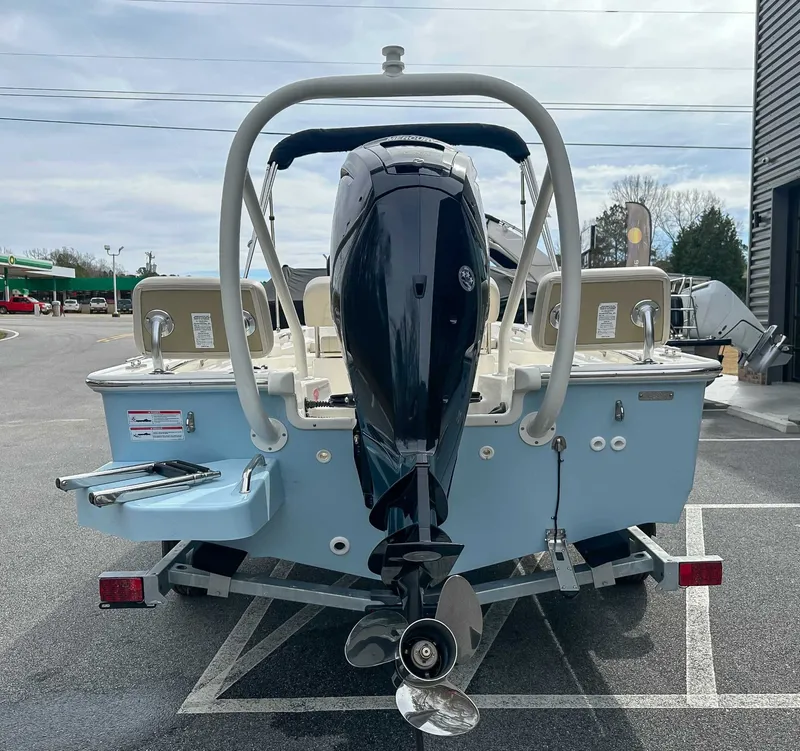 Slide: The Image of Rear view of a 2025 Boston Whaler 170 Montauk boat on a trailer. - 9