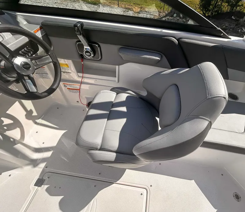 Slide: The Image of Interior of 2026 Chaparral 23 SSi with steering wheel and seat. - 13