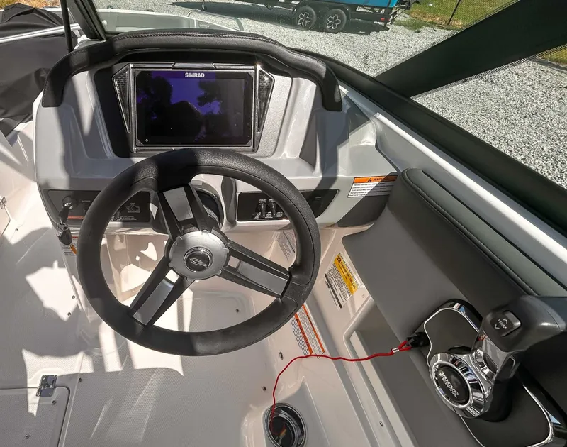 Slide: The Image of Interior view of Chaparral 23 SSi 2026 helm with Simrad display. - 14