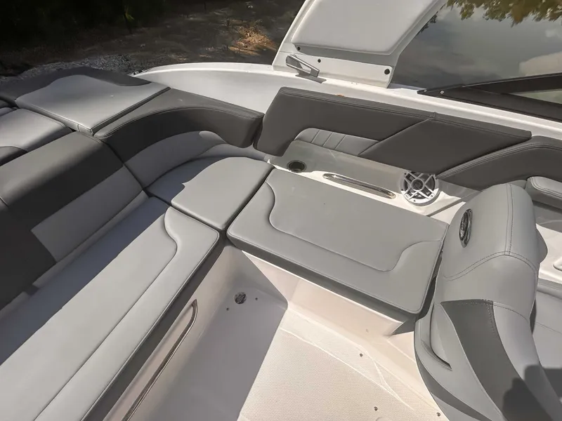 Slide: The Image of 2026 Chaparral 23 SSi interior with gray upholstery. - 18