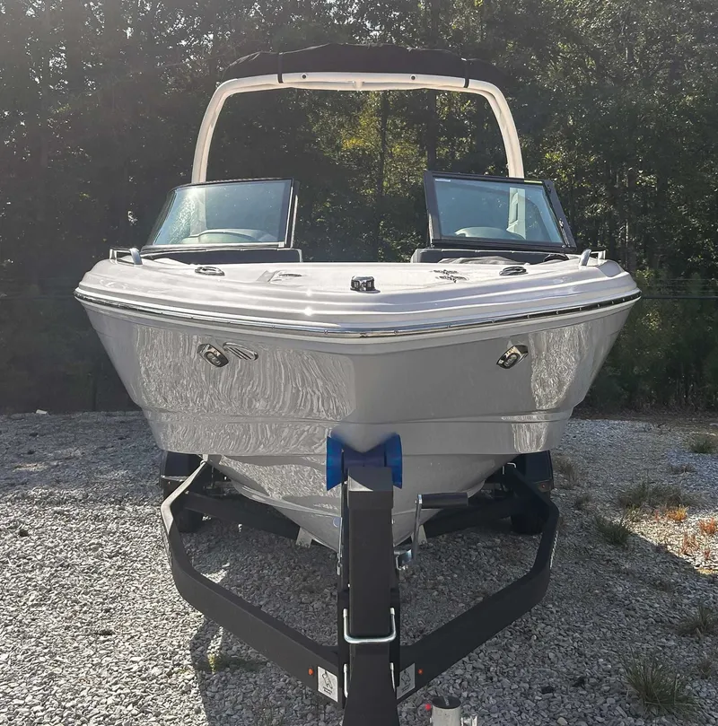 Slide: The Image of Chaparral 23 SSi 2026 boat on trailer outdoors. - 4