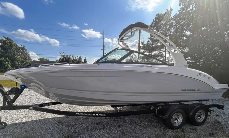 Slide: The Image of 2026 Chaparral 23 SSi boat on trailer under sunny skies. - 6