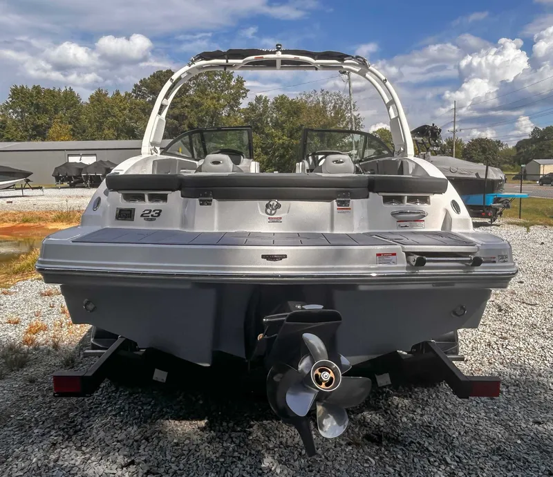 Slide: The Image of Rear view of 2026 Chaparral 23 SSi boat on gravel. - 8