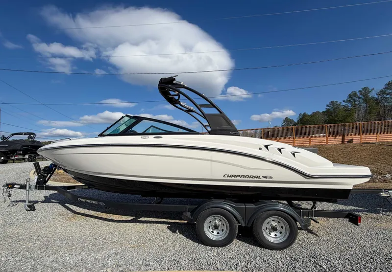 The Image of 2026 Chaparral 23 SSi boat on trailer, blue sky. - 1