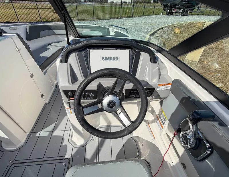 Slide: The Image of 2026 Chaparral 23 SSi boat cockpit with Simrad display. - 14
